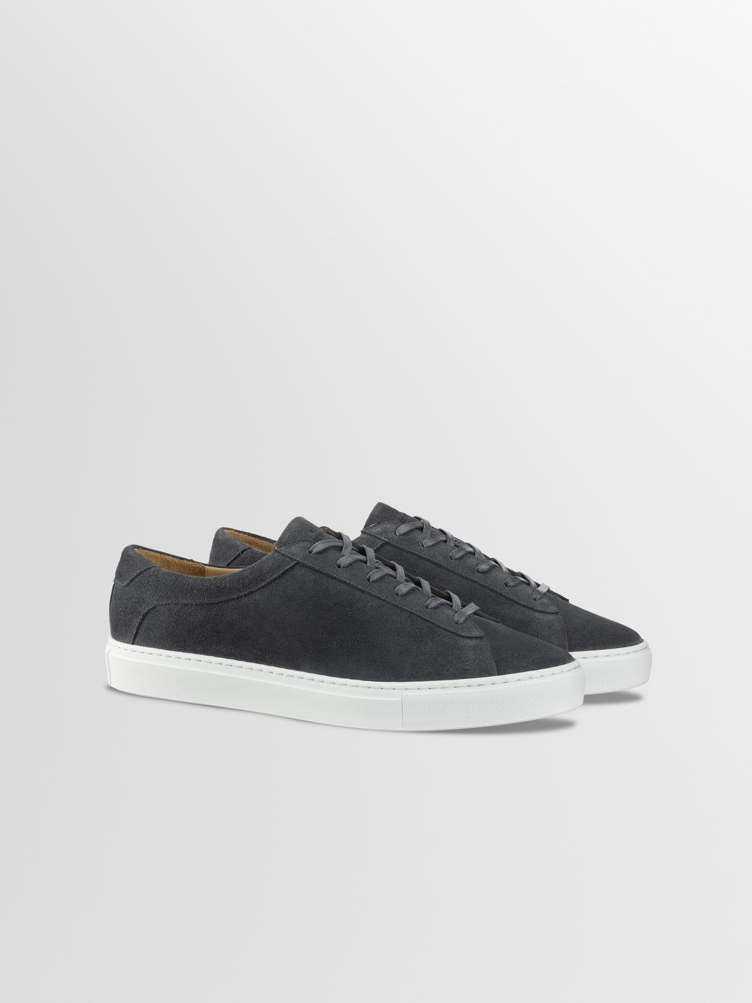 Three-quarter view of men’s Capri in Roccia low-top sneakers with grey suede uppers and white rubber soles