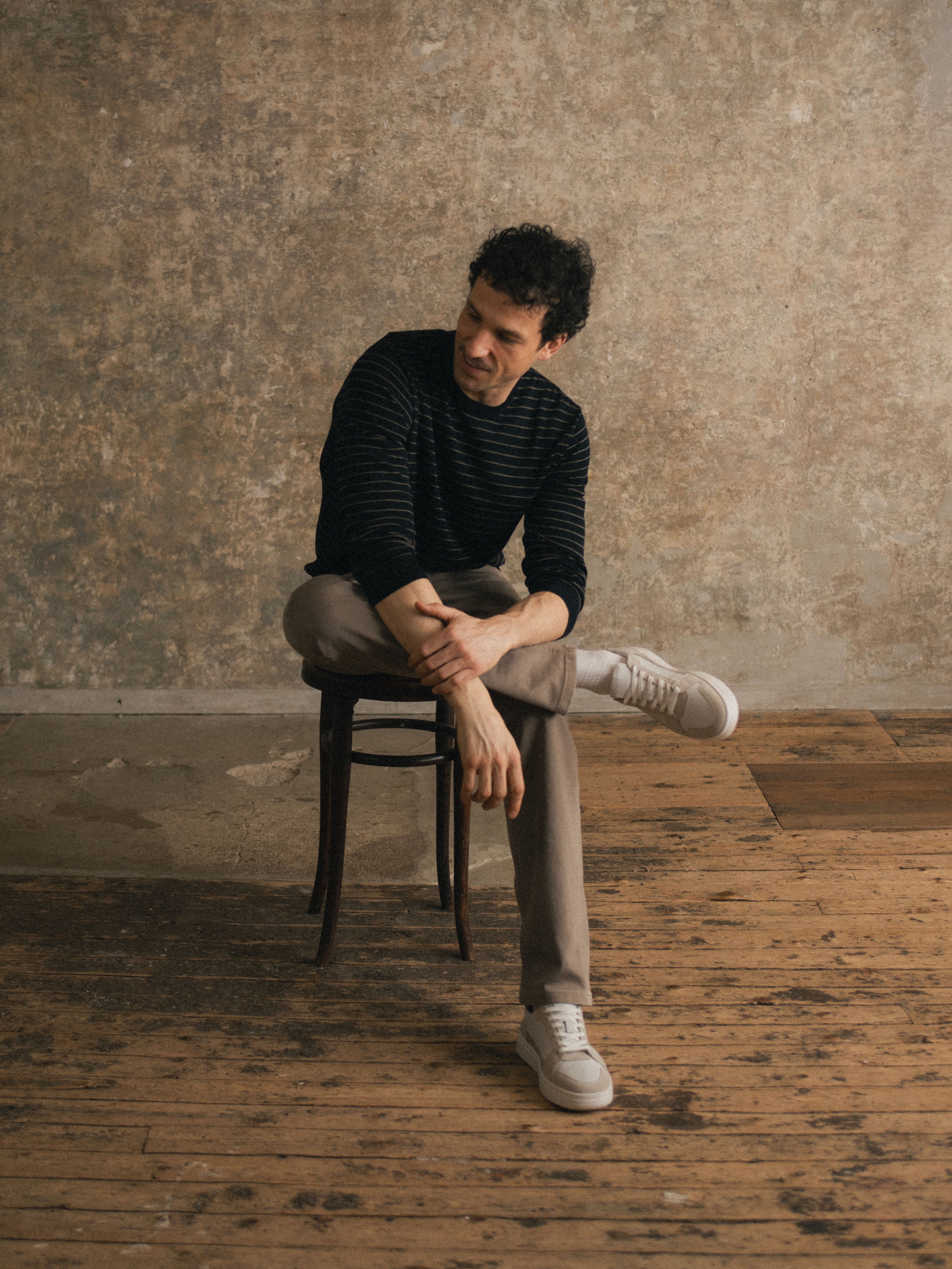 Man sitting on chair wearing Men
